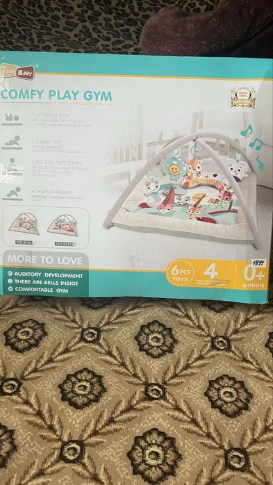 Розвиваючий килимок с ігрішками та музика