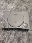 PlayStation 1 com comando e jogos
