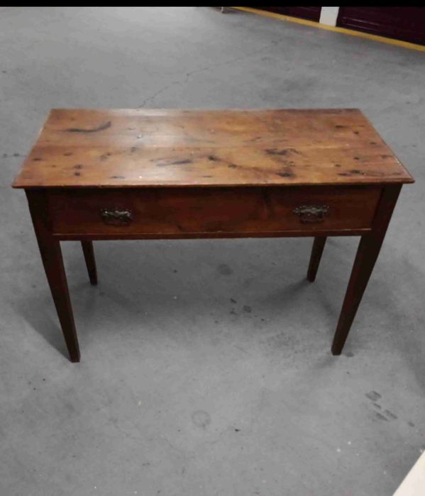 Antique wooden occasional table with a single drawer and tapered legs.