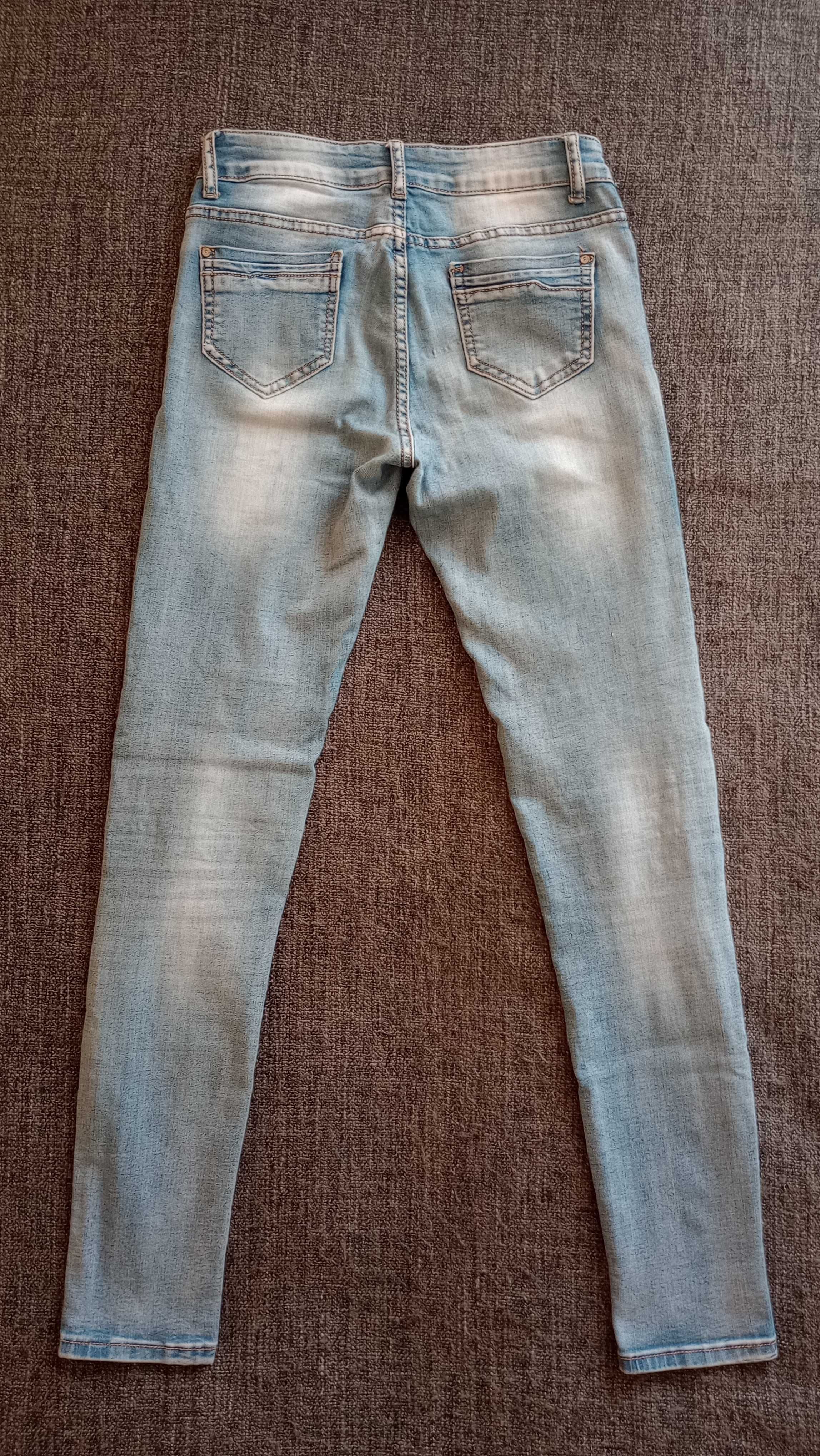 Skinny jeans 26 jasnoniebieskie z efektem sprania