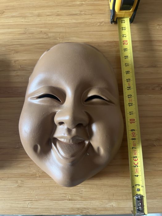 Cara de buda em ceramica