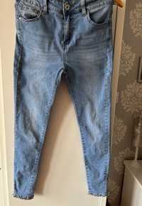 Spodnie jeansowe z cyrkoniami, perełkami i kokardkami r. S/M