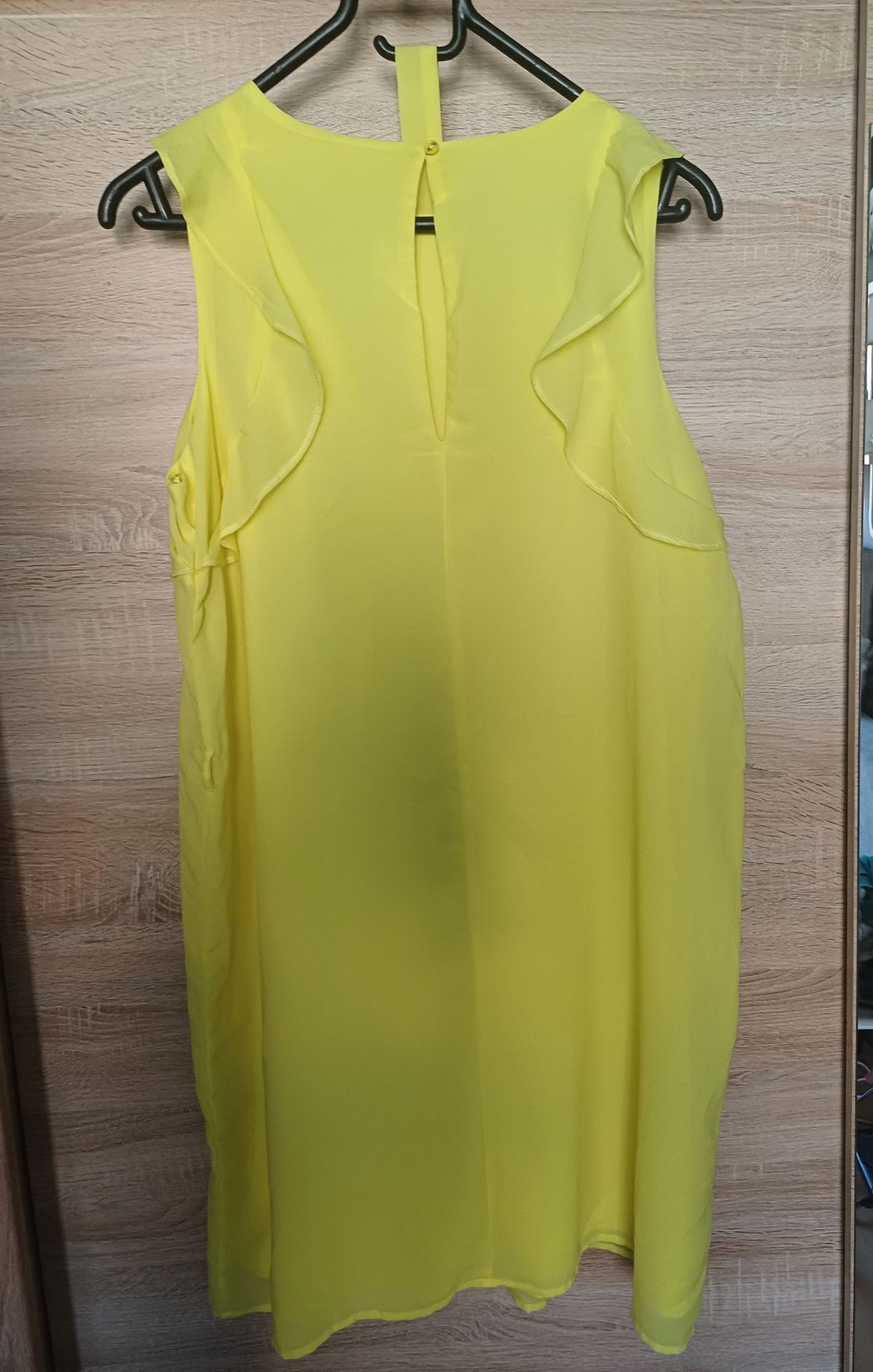 Sprzedam nową żółtą sukienkę , rozmiar 40.
