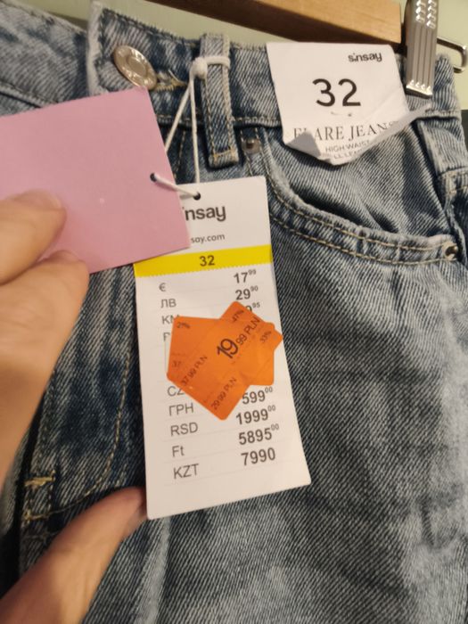 Sinsay jeansy flare z dziurami 32 nowe