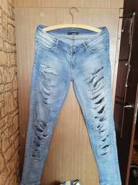Spodnie jeansy Tally Weijl z dziurami