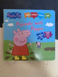 Książka Peppa po niemiecku z puzzlami