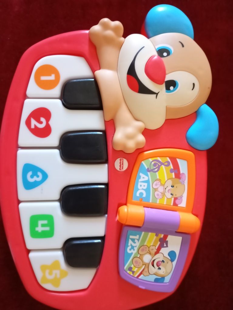 Piano eletrônico Fisher price em francês