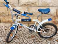 Bicicleta BMX esmaltina com duplo amortecedor