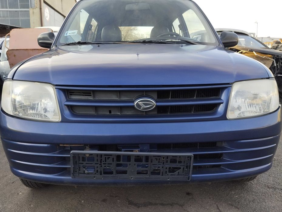 Daihatsu Cuore 1.0i 5D 1999r.Zderzak przedni.