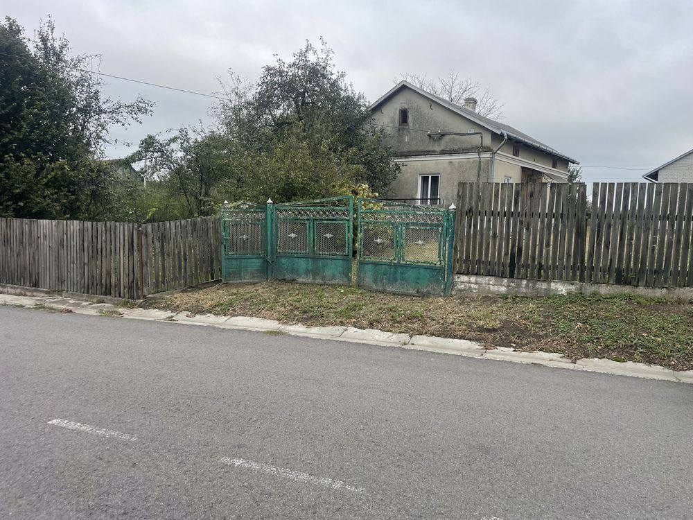 Будинок ,земельна ділянка під забудову