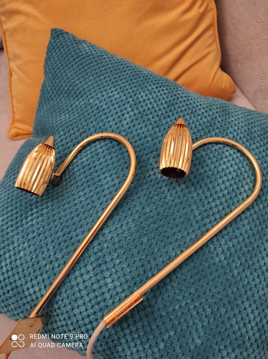 Lampy kinkiety ścienne mogą świetnie podświetlać obrazy i nie tylko