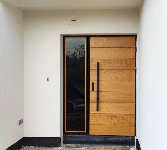 Drewniane drzwi zewnętrzne wejściowe od producenta "Czyste powietrze"