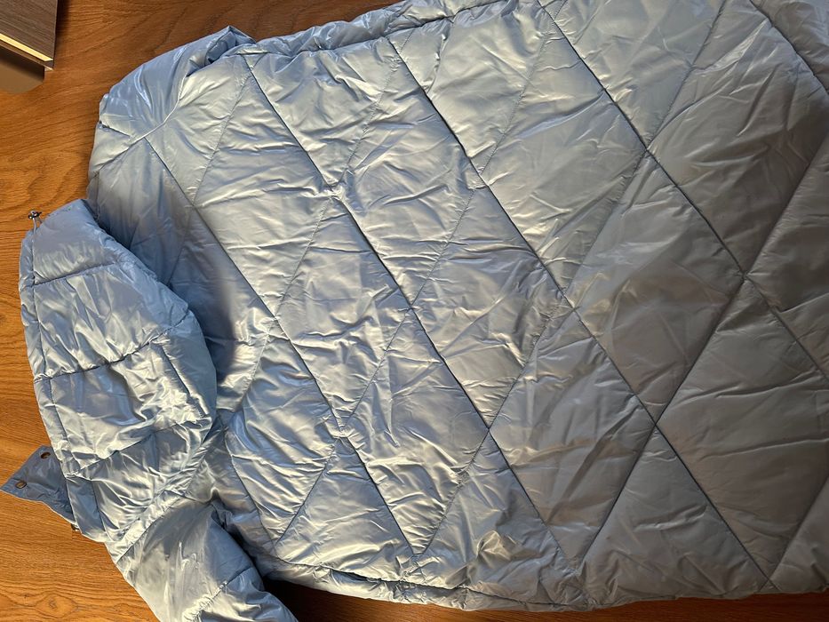 Стильний подовжений пуховик