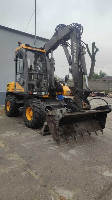 Koparko-ładowarka Mecalac 12MTX. Rok produkcji 2012. Komplet łyżek