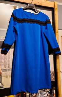 Niebieska sukienka marki Reserved