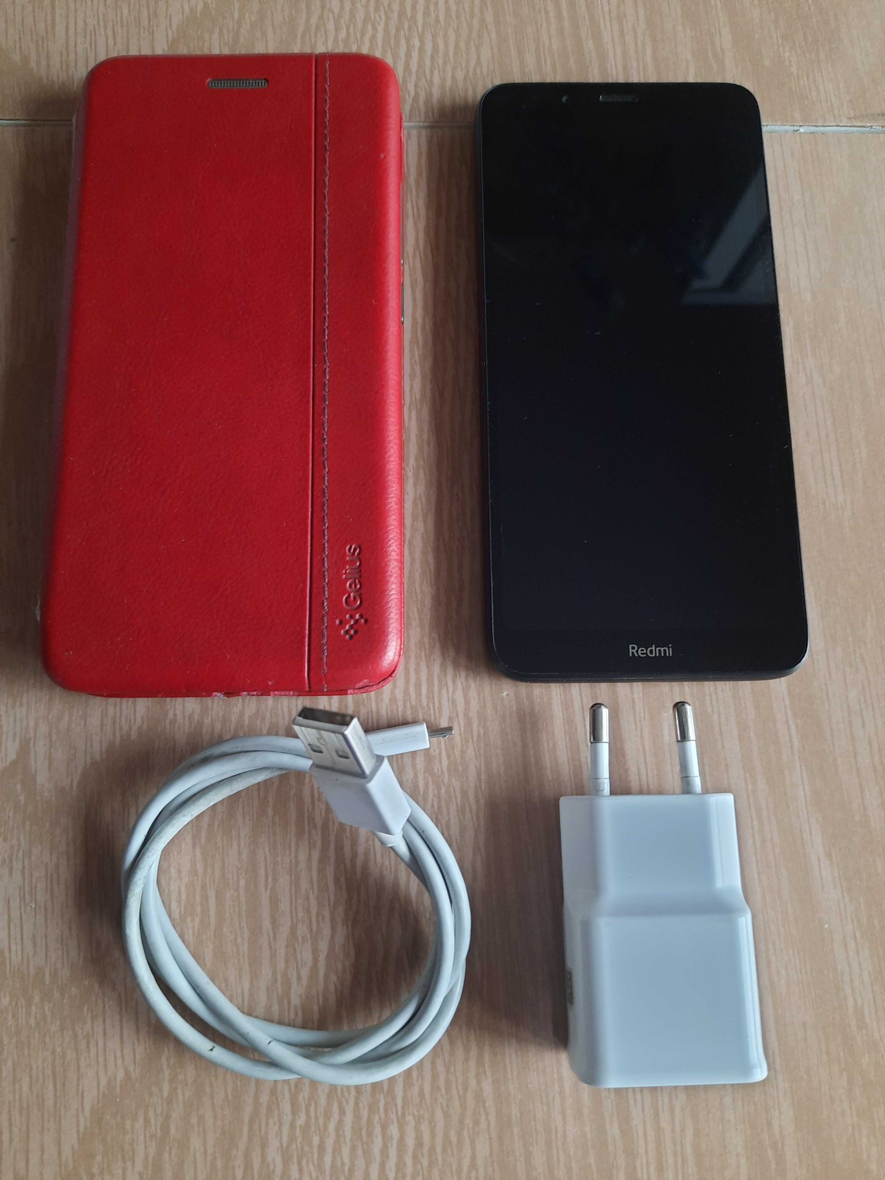 Телефон Xiaomi Redmi 7a черного цвета + чехол + зарядное.