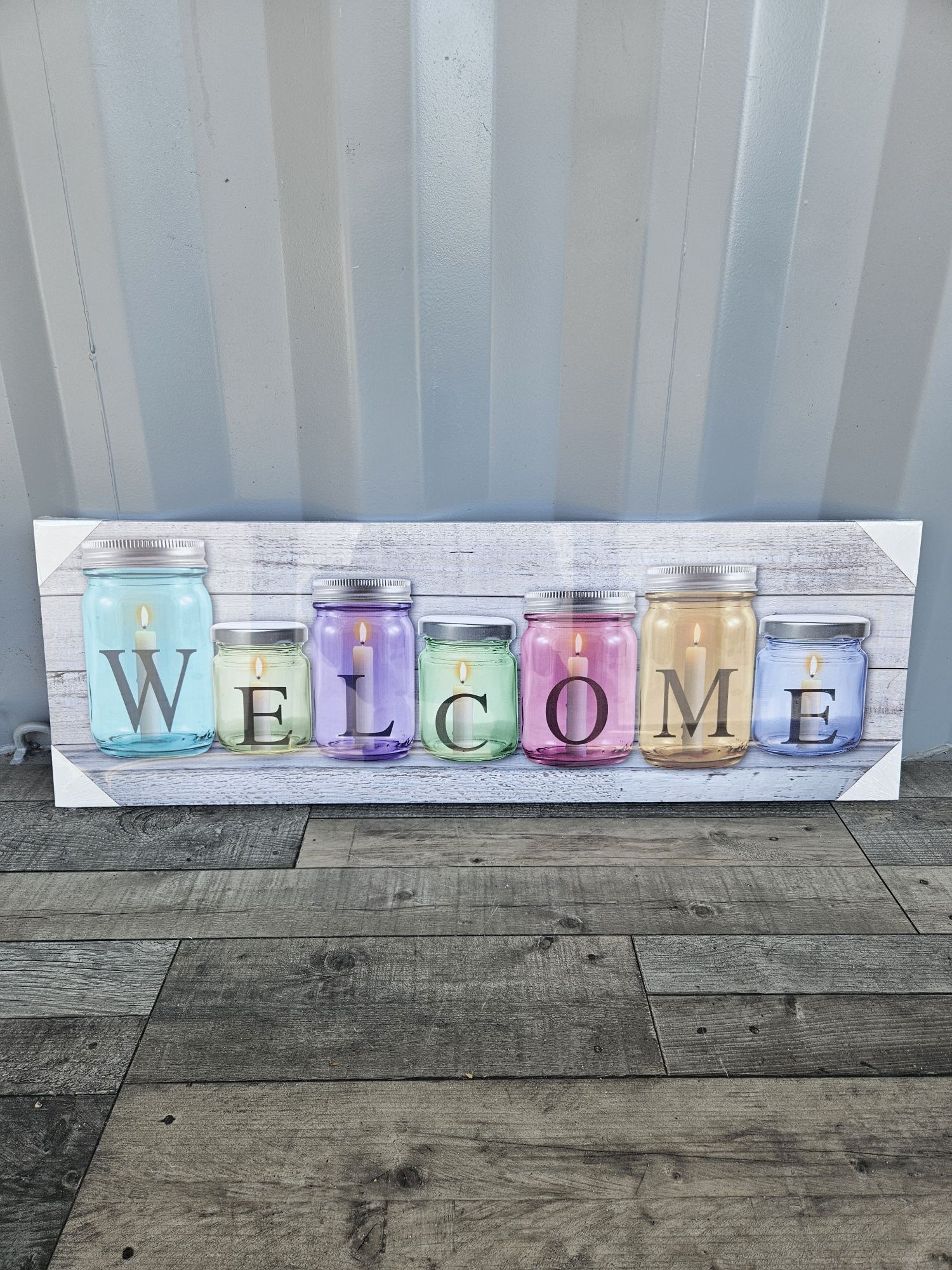 Obraz obrazek welcome świeczki w słoikach