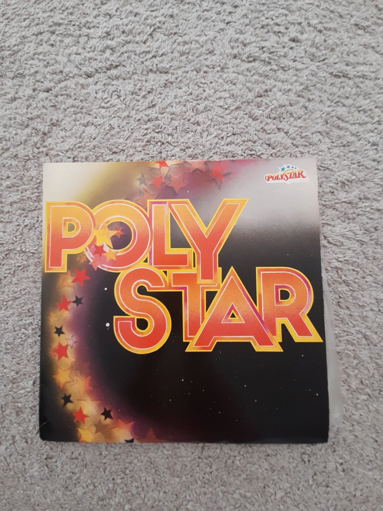 Álbum de vinil duplo com uma colectânea de êxitos Poly Star