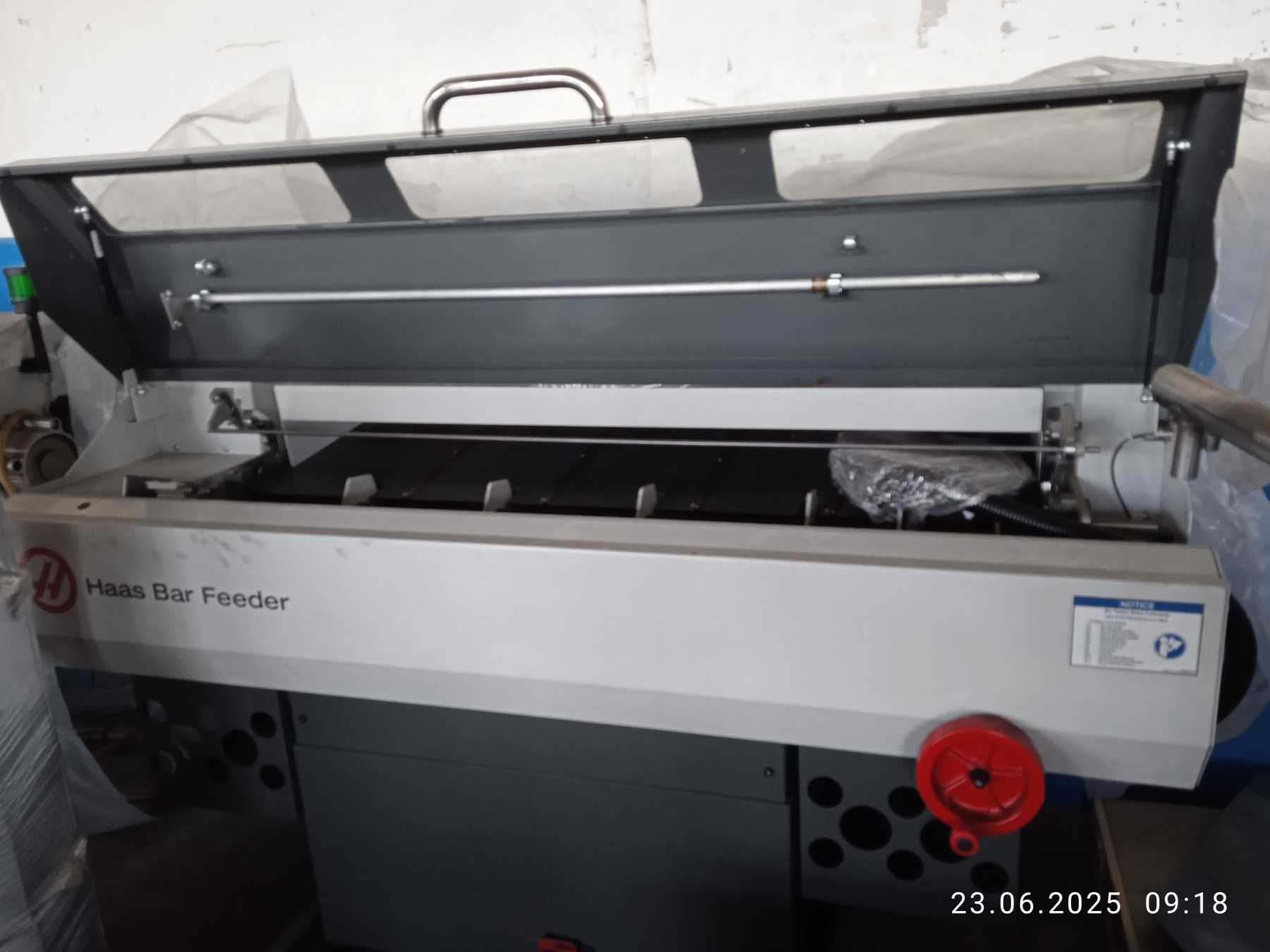 Подавач прутків, пруткоподавач Haas