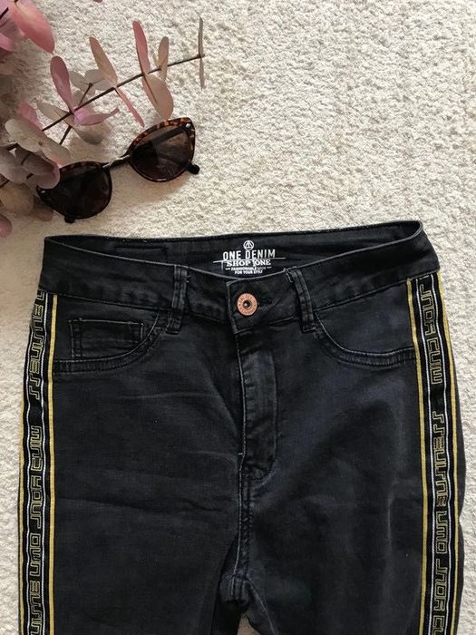 calças pretas skinny