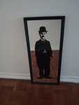 Espelho Charlie Chaplin em moldura preta