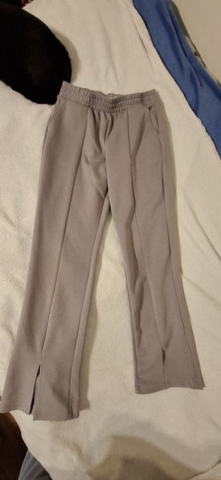 Spodnie szare ze szwami i rozporkami na nogawkach  rozm.M
