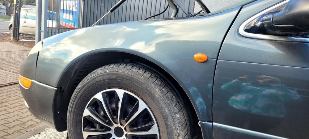 BŁOTNIK LEWY CHRYSLER MODEL 300M 2002