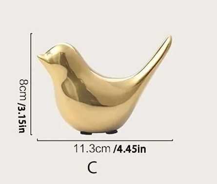Złocona ozdoba, dekoracja w kształcie ptaka.