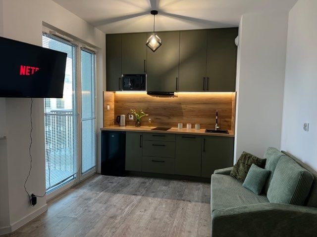 Sofa dwuosobowa material sztruks z funkcją spania