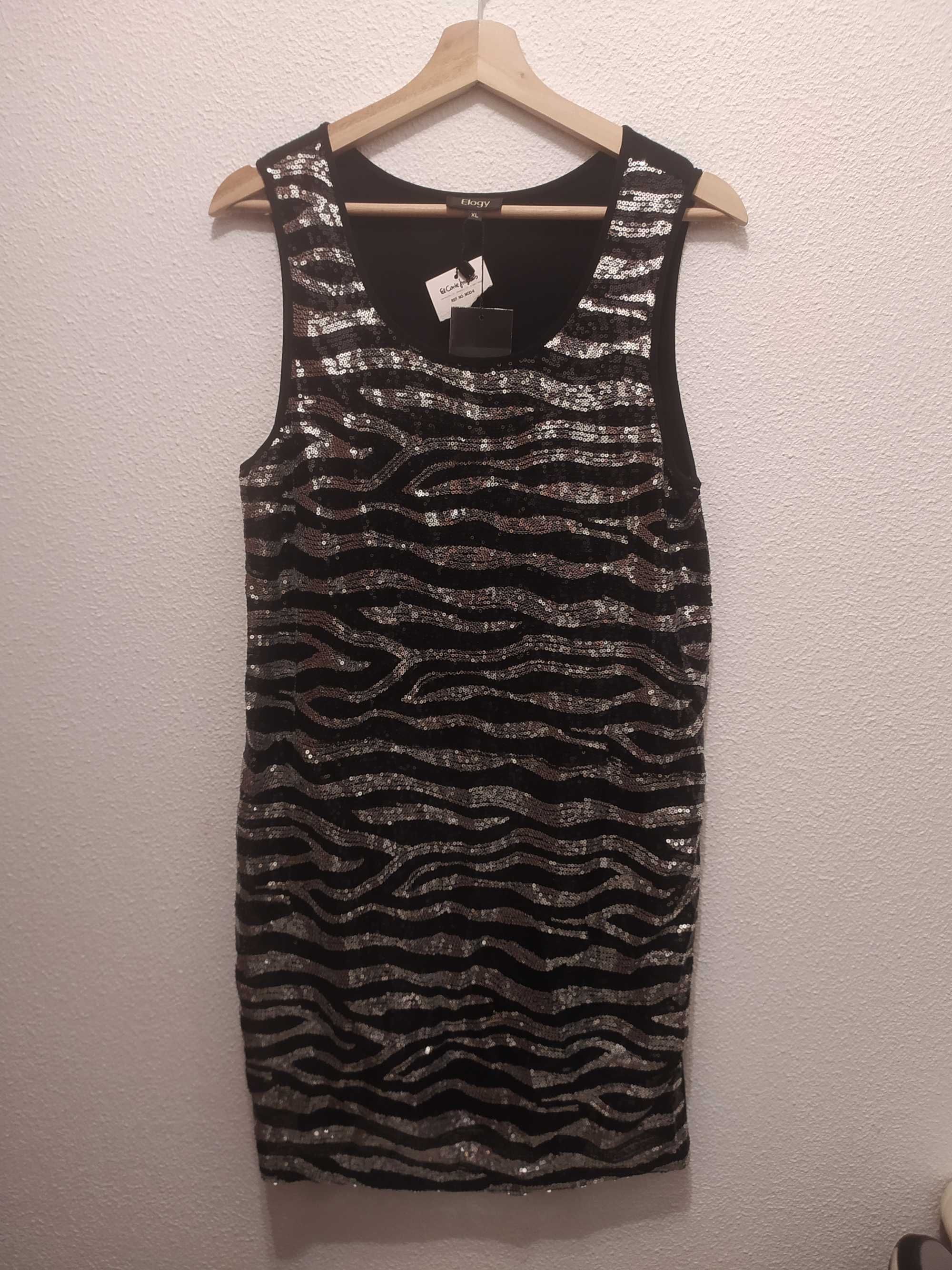 Vestido de lantejoulas, preto e prata.
Marca: Elogy
Tam: XL