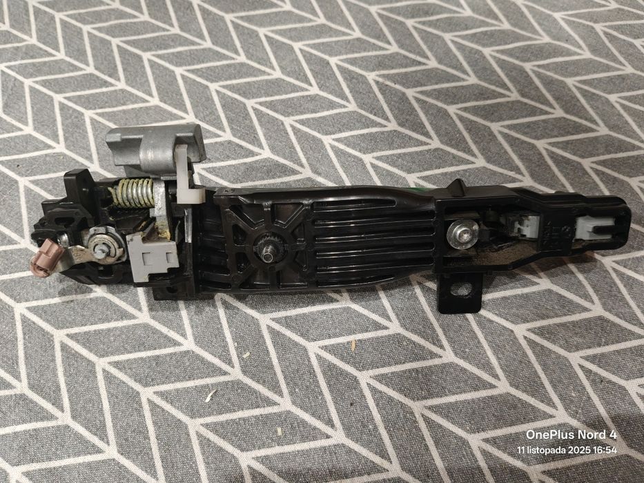 Klamka lewa przód przednia zielona Mazda 2 DE 07-10