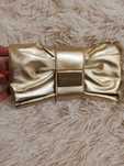 złota kopertówka Versace Parfums