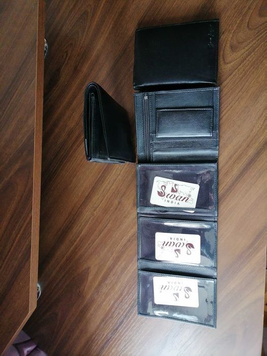 Гаманці чоловічі нові