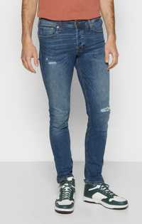 Spodnie jeansowe męskie z dziurami przetarciami Jack&Jones W29/L32