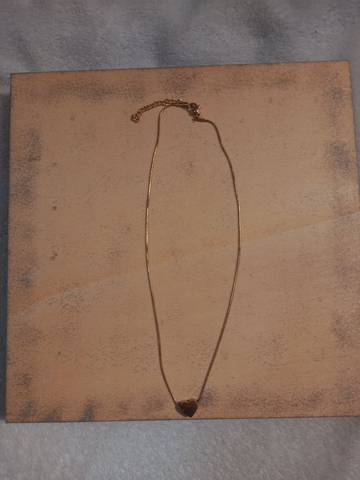 Fio dourado com coração