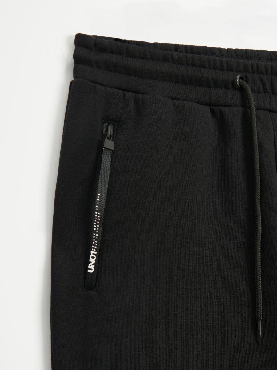 Nowe z metką joggery dresowe spodnie dresy House S bawełniane napisy
