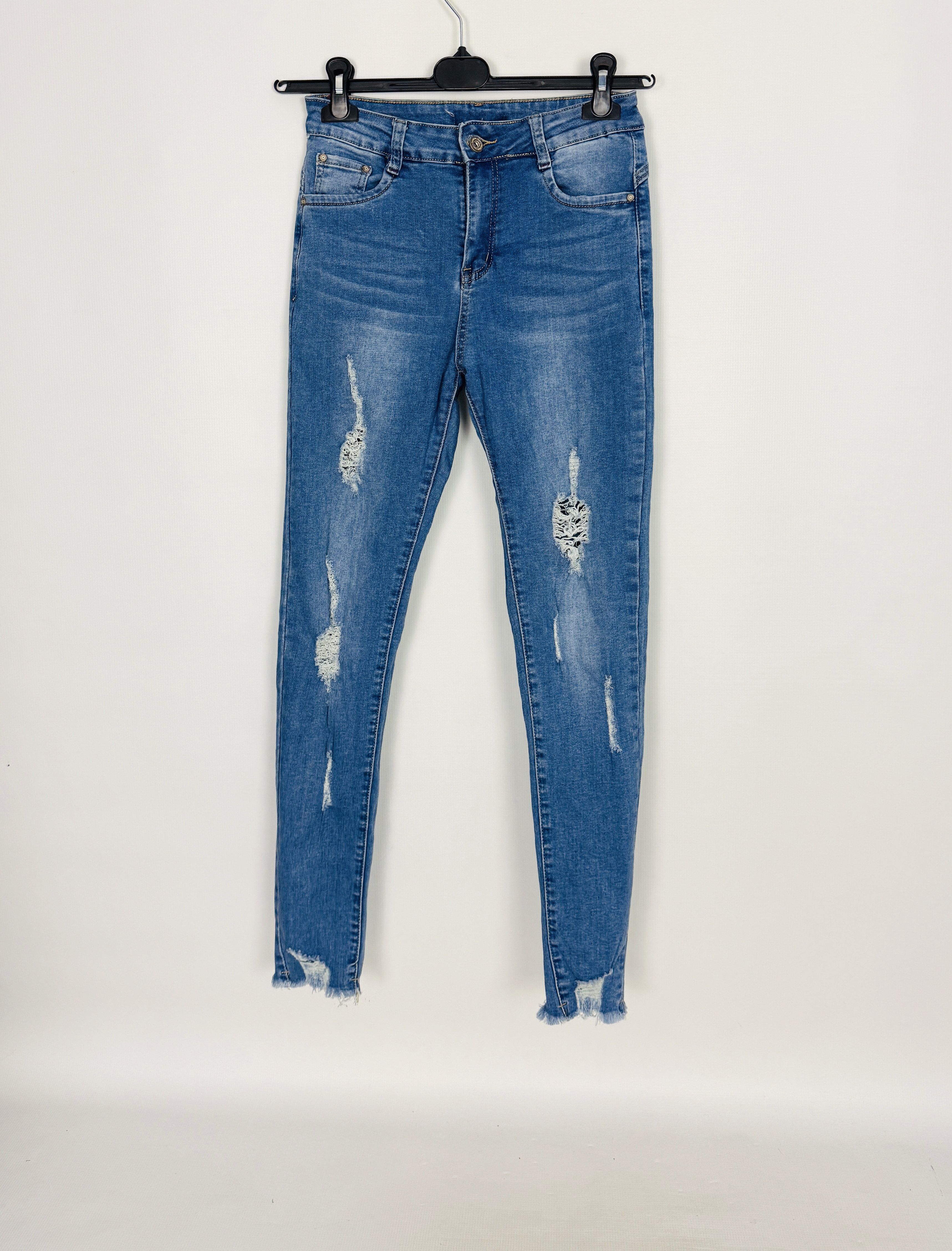 Jasnoniebieskie jeansowe spodnie rurki z przetarciami S 36