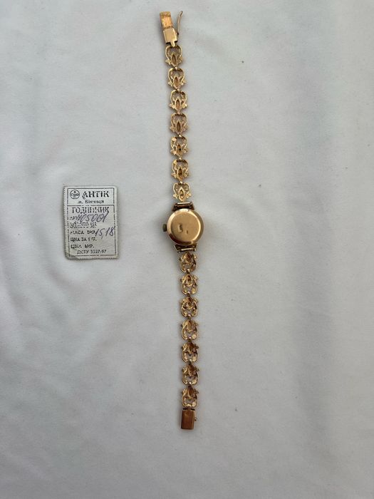 Золотий  жіночий годинник