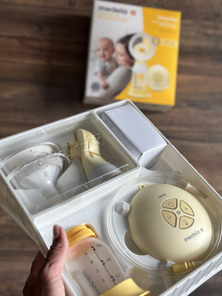 Молоковідсмоктувач medela swing flax