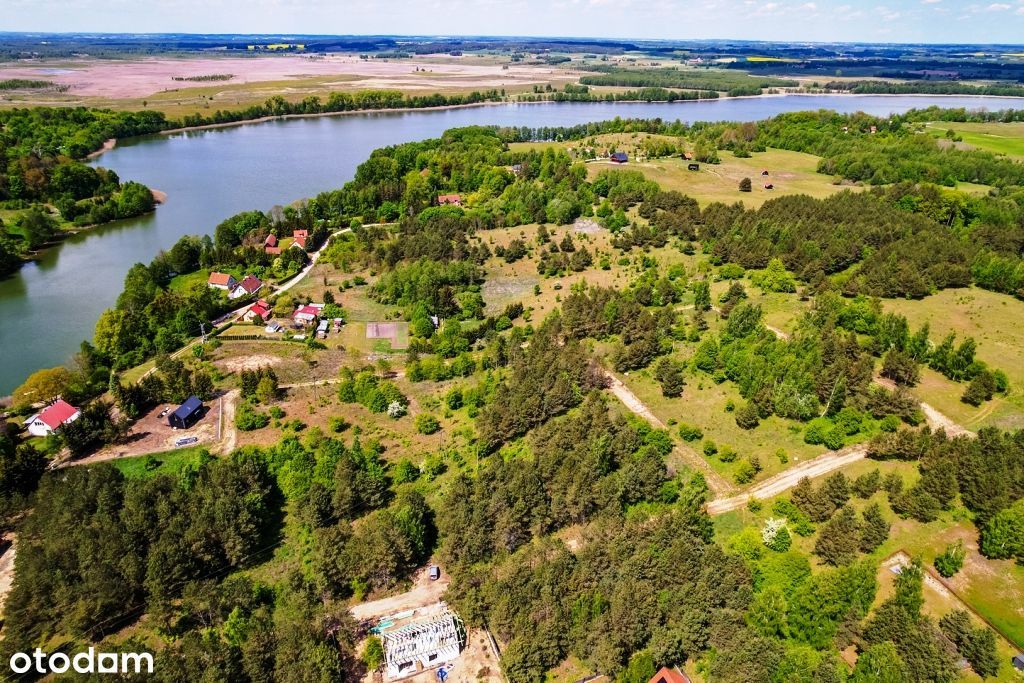 Piękne działki w otoczeniu krzewów z dostępem do jeziora Buwełno