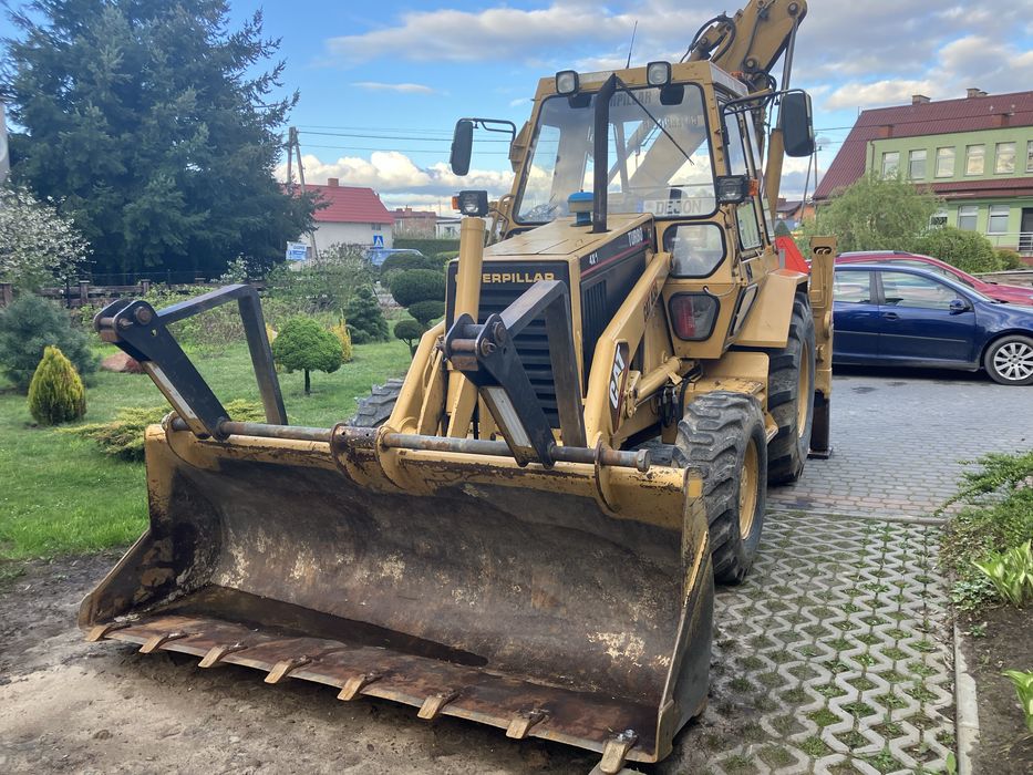 Koparko-ładowarka Caterpillar 438