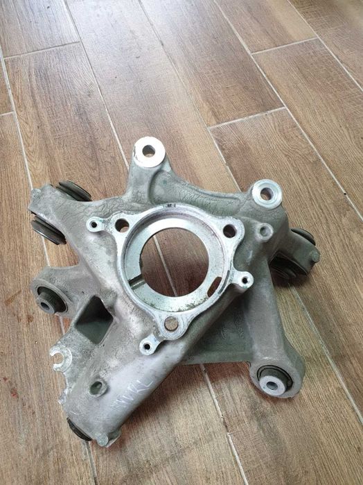 Цапфа поворотний кулак передній задній павий лівий Tesla Model Y