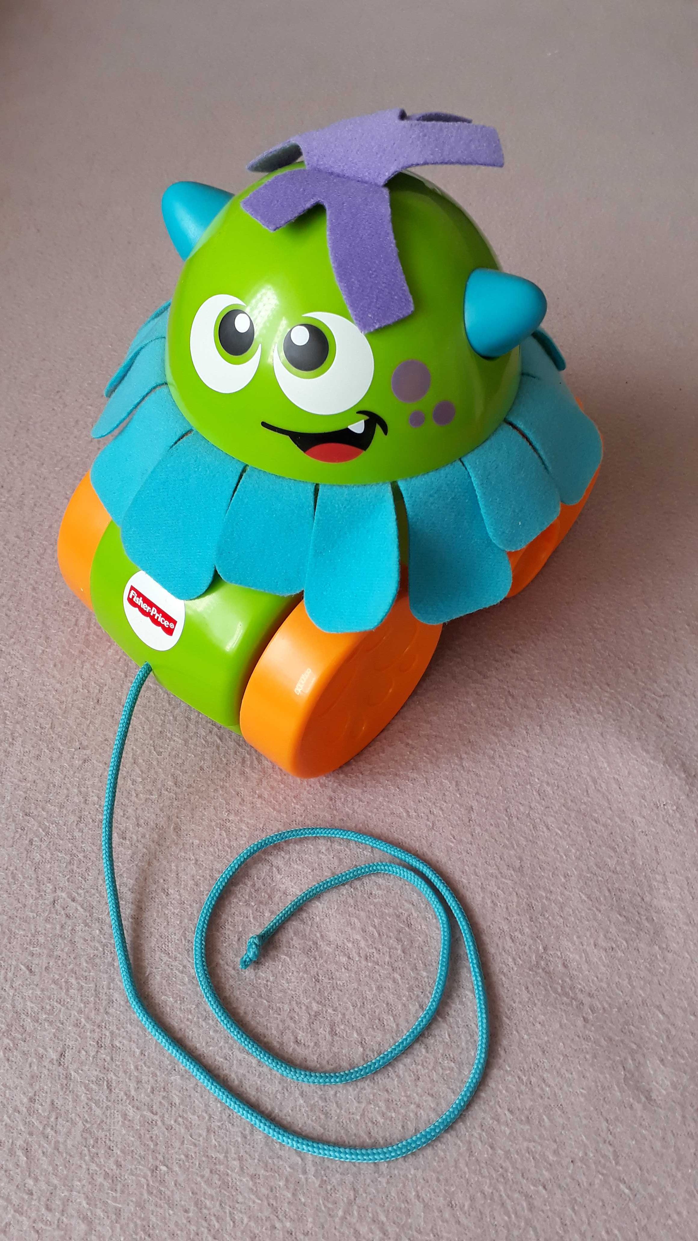 Fisher Price spacerowy stworek