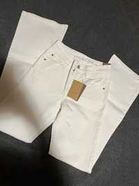 Spodnie Promod Eugene białe flare jeansy mid rise S 36