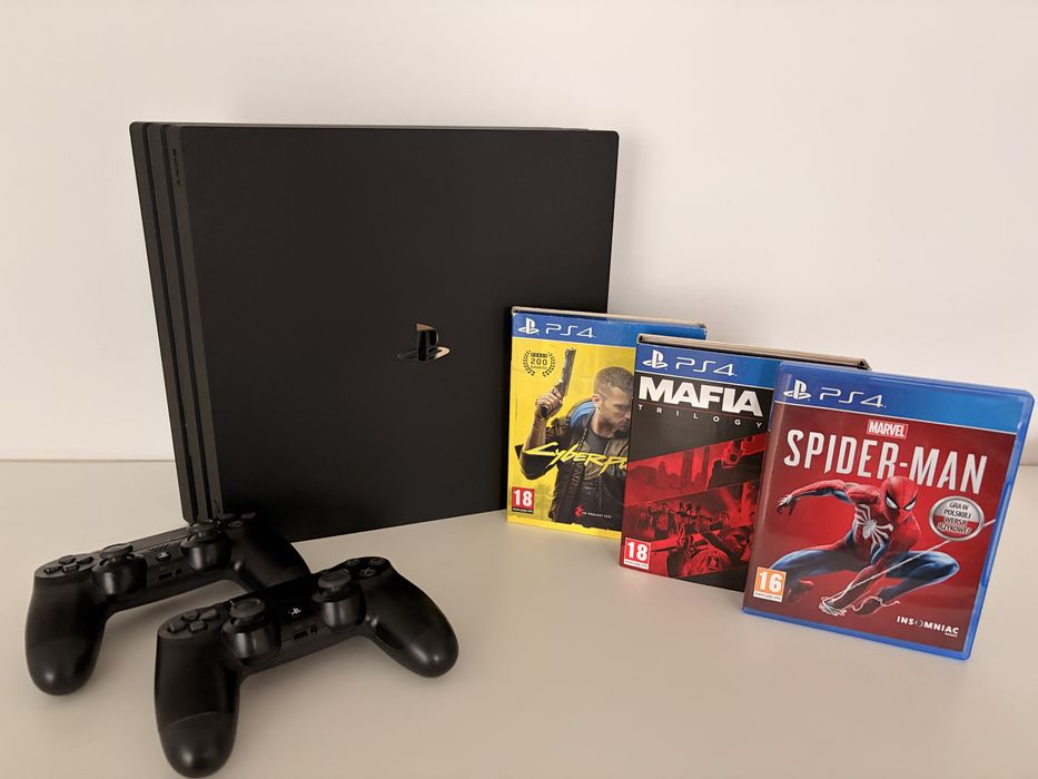 PS4 Pro 1TB + 2 pady + gry