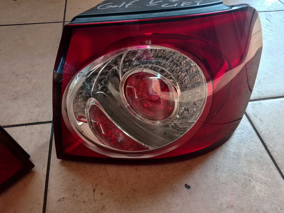 VW GOLF V 5 PLUS lampa lampy tył w błotnik