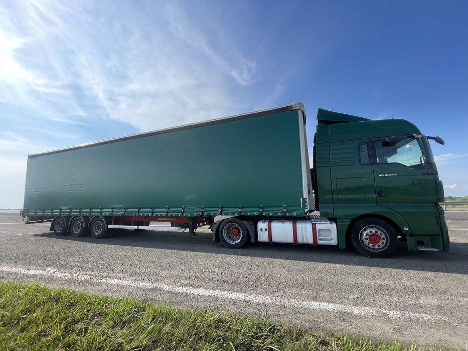 Тягач Man TGX 18.440 MEGA + напівпричіп штора Kassbohrer осі SAF
