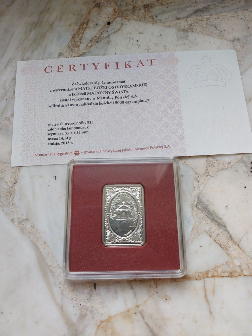 Srebrny numizmat z wizerunkiem Matki Bożej