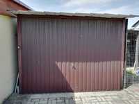 Garaż blaszany z bramą uchylną i instalacją elektryczną. Zdrowy