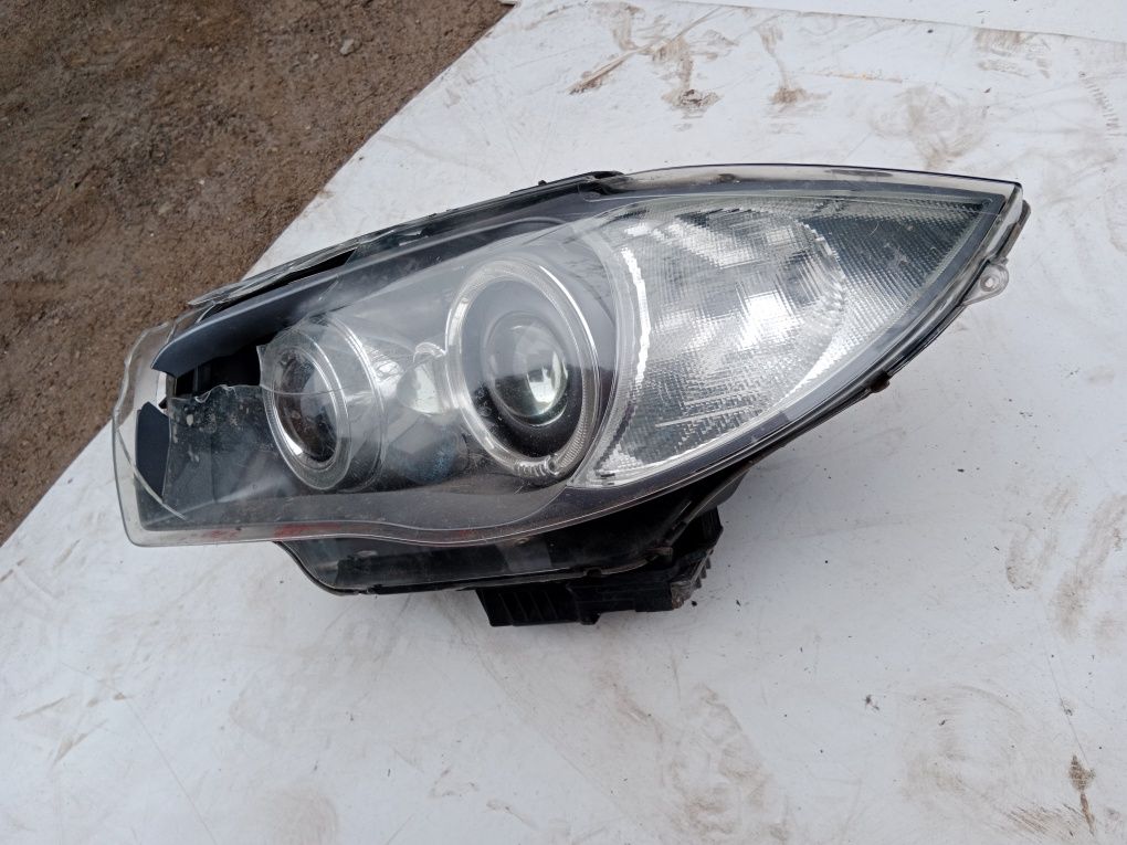 BMW E87 lampa przód lewa bi xenon